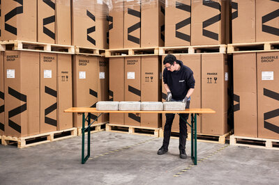 A still image shows a load test of a classic beer table. 