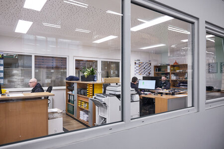The photo shows an outside view into the production office.