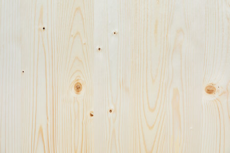 The wooden top of the beer garden table sets in nature.